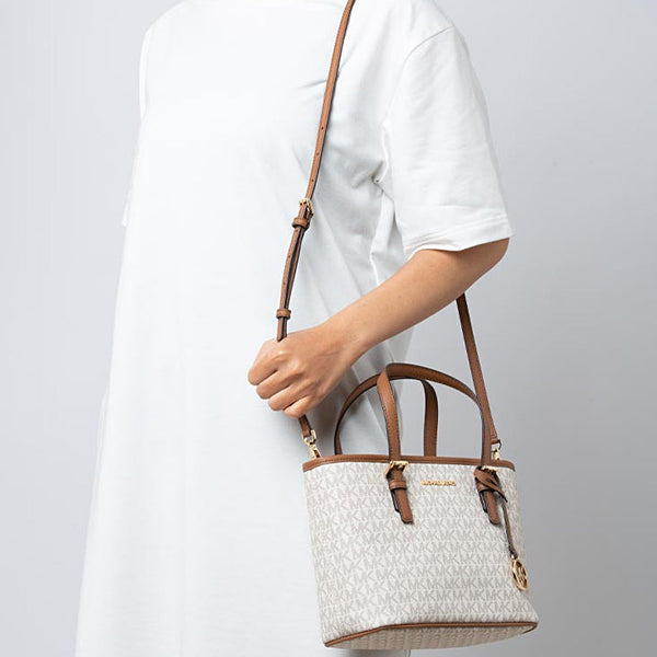 Micheal Kors small Jet Set Travel tote bag with top zip closure and logo in white