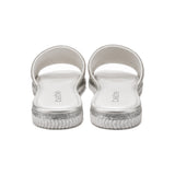 Bebe Rhinestone Logo Slide Sandals In White/Silver