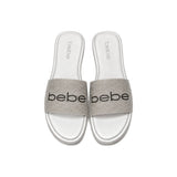 Bebe Rhinestone Logo Slide Sandals In White/Silver
